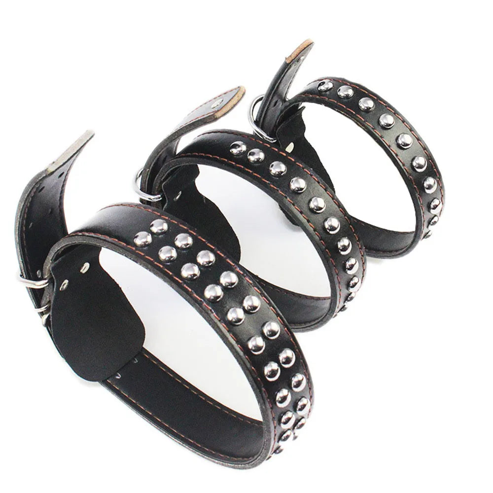 Three black studded wide dog collars with silver-tone buckles and studs