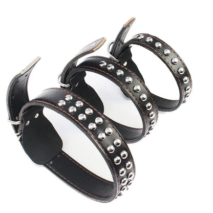 Three black studded wide dog collars with silver-tone buckles and studs