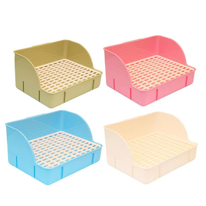 Beige, blue, pink, and green raised-grid rabbit litter boxes