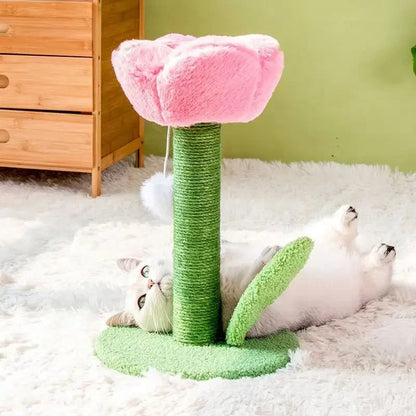 White cat playing on a pink tulip-shaped cat tower